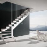 Escaleras Mixtas: Cómo elegir entre estructura central metálica o lateral